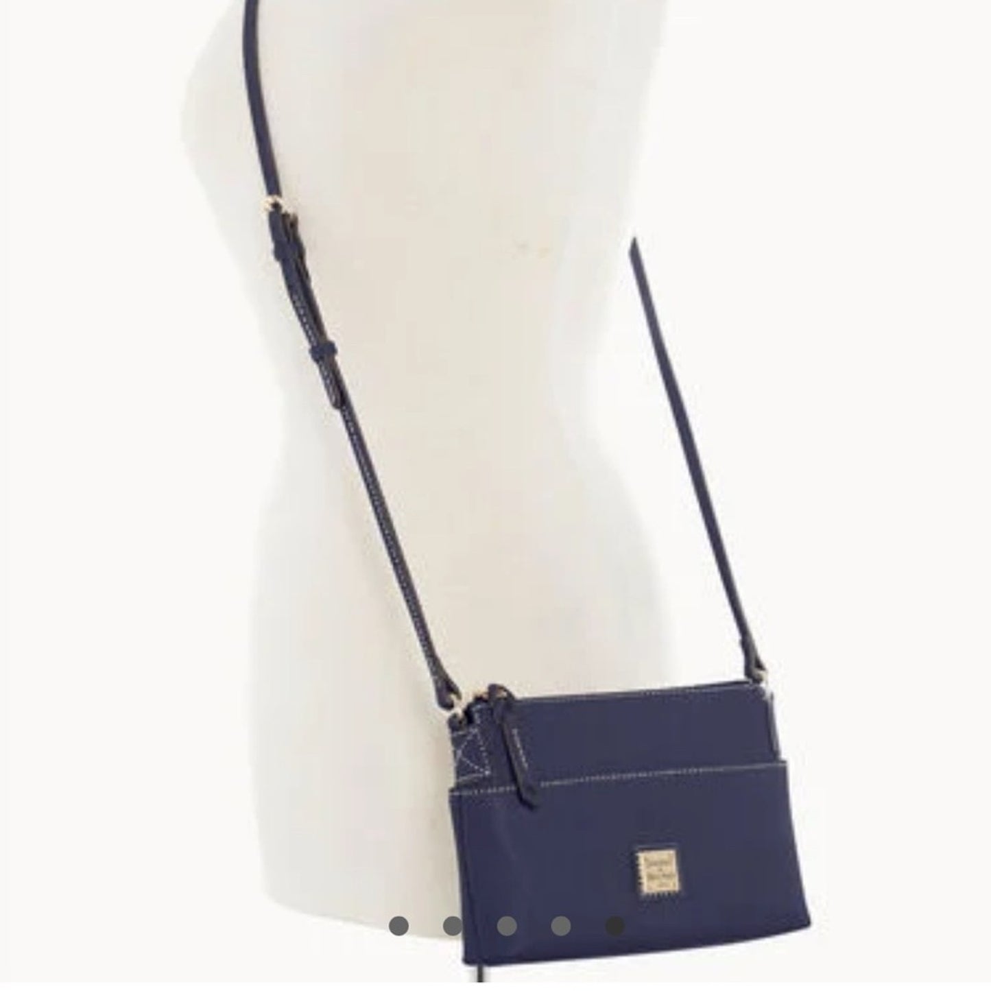 Navy blue crossbody bag on a mannequin with a white background