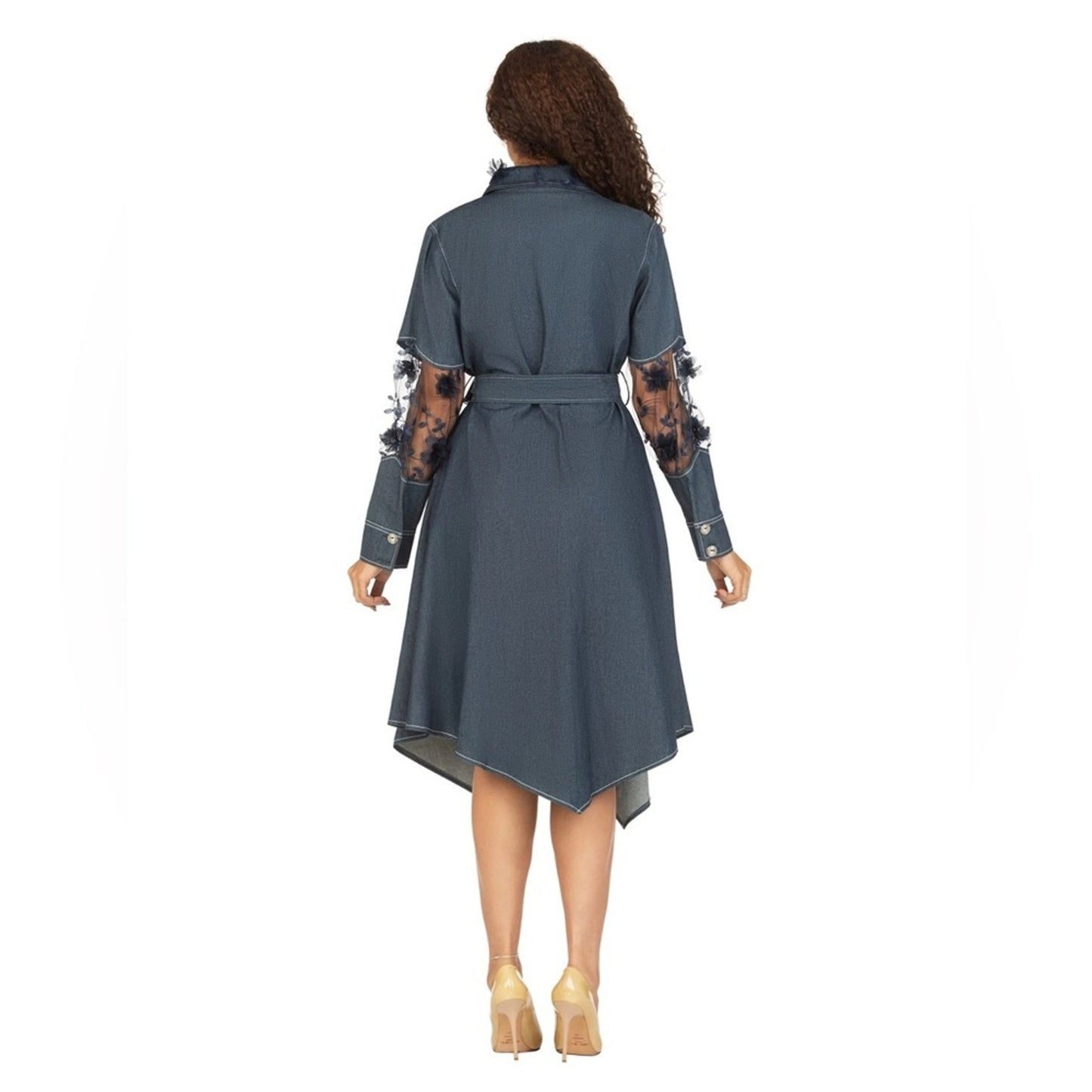 Woman wearing a gray dress with lace sleeves on a white background