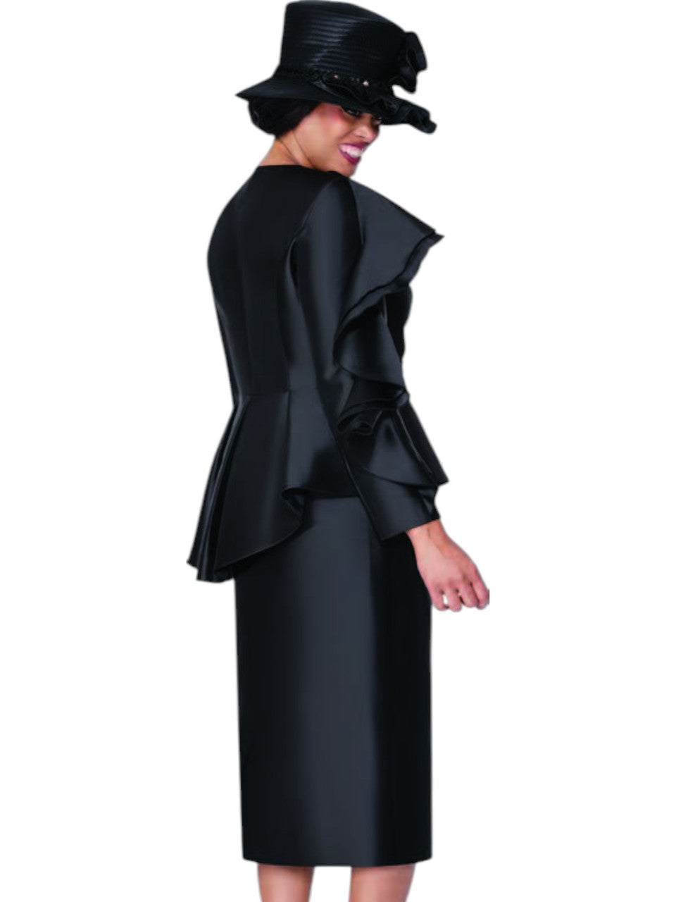 Woman wearing a black outfit with ruffled top and skirt on a white background