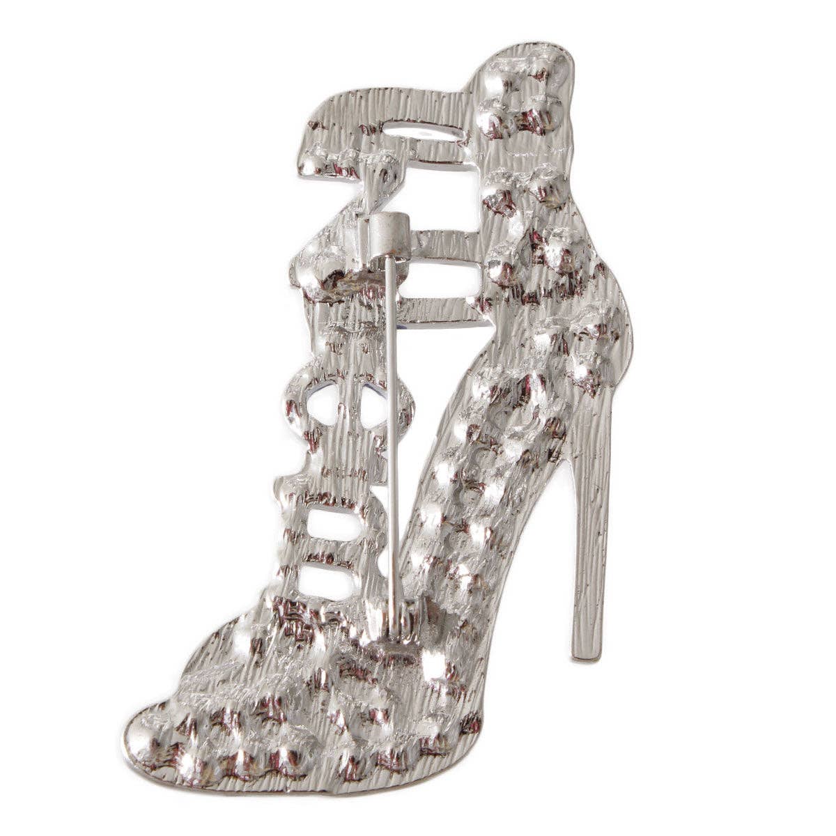 Crystal high-heeled shoe brooch on a white background