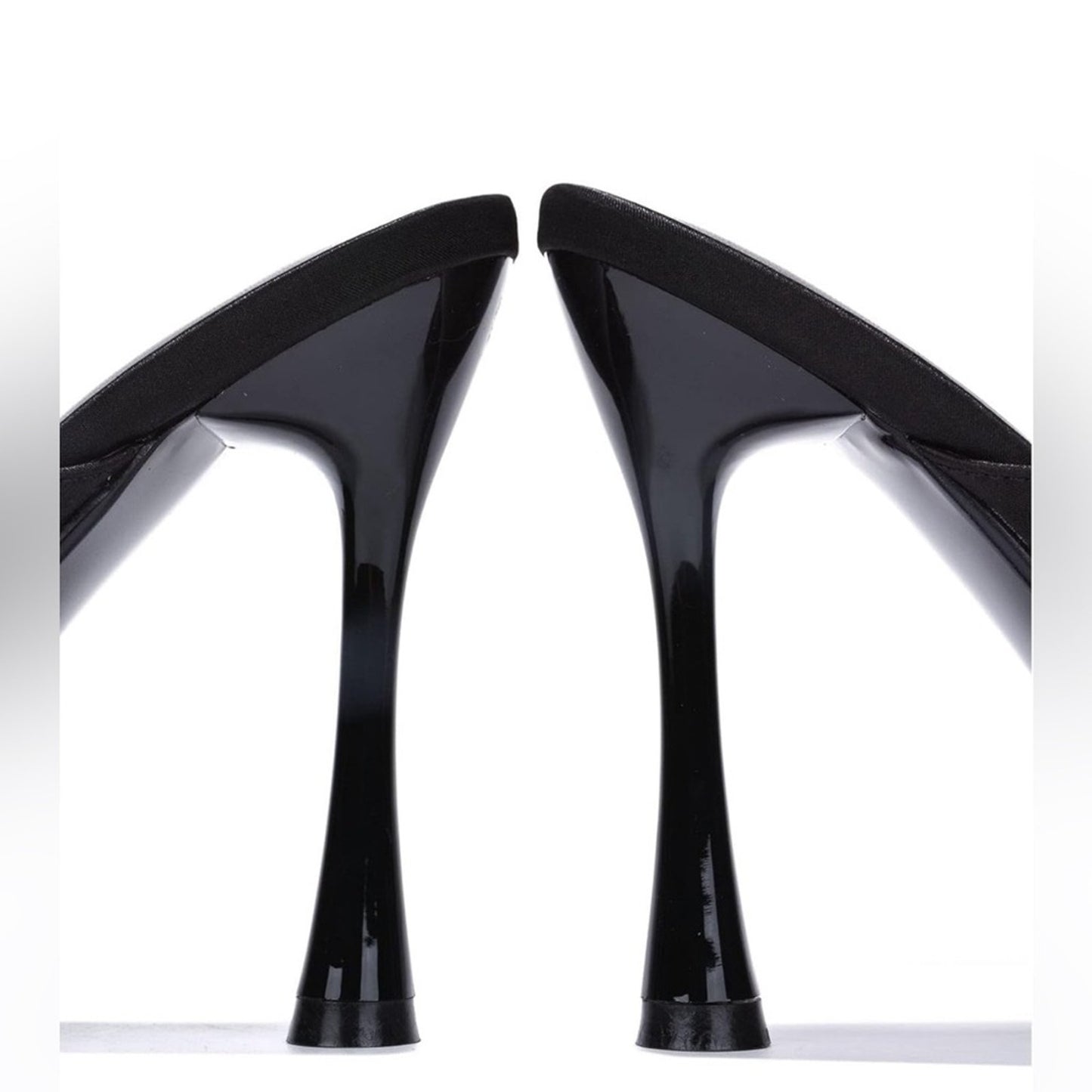 Black high-heeled shoes on a white background