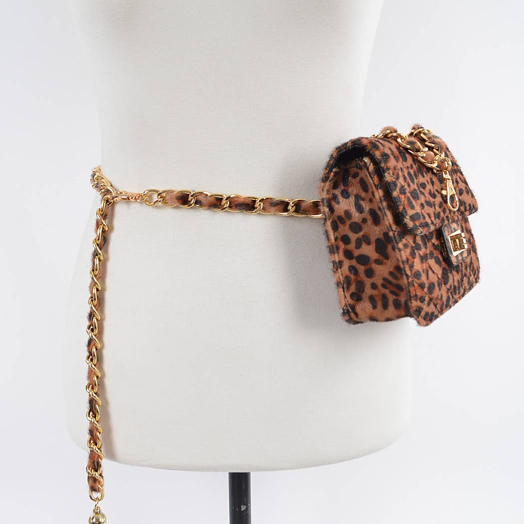 Leopard print handbag with gold chain strap on a mannequin against a white background
