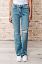 Load image into Gallery viewer, Isla Mid Rise Distressed Released Hem Bootcut Jeans
