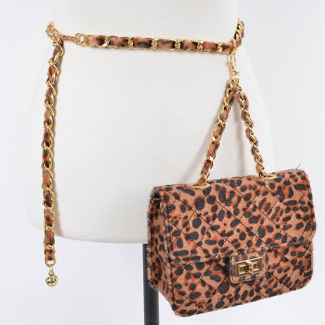 Leopard print handbag with gold chain strap on a mannequin.