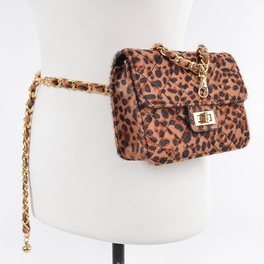 Leopard print handbag with gold chain on a mannequin bust.