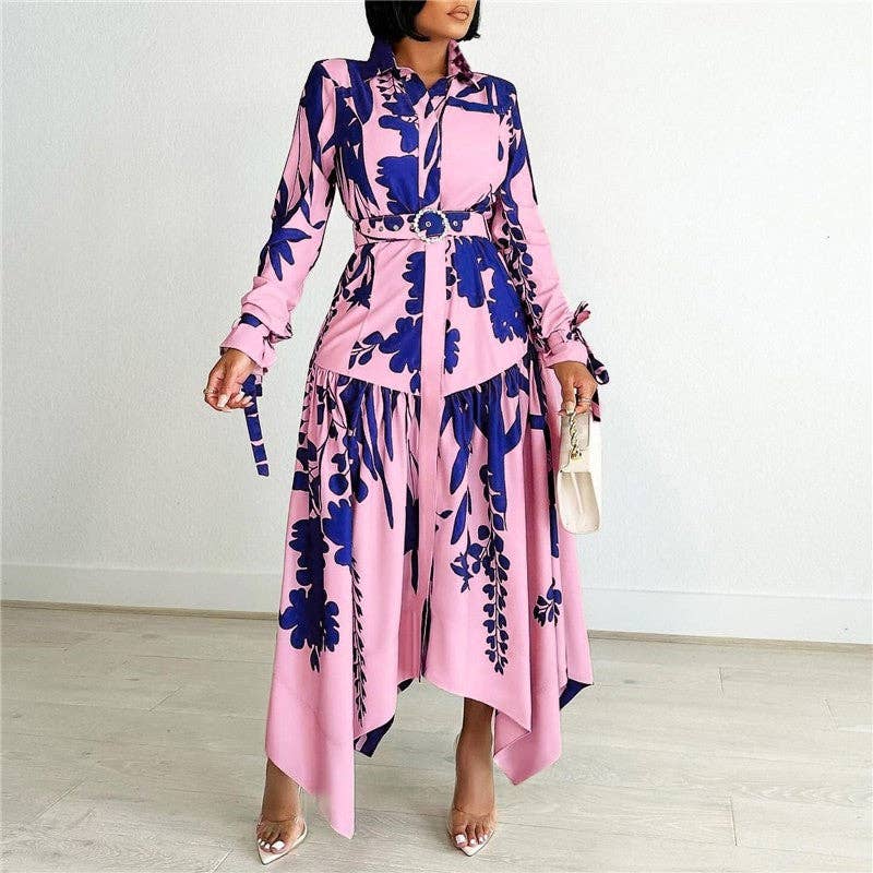 Woman wearing a pink and blue floral dress against a white background
