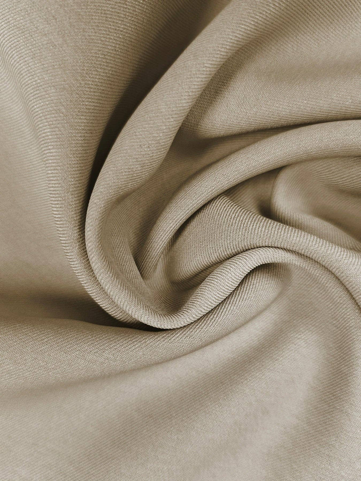 Close-up of beige fabric with folds