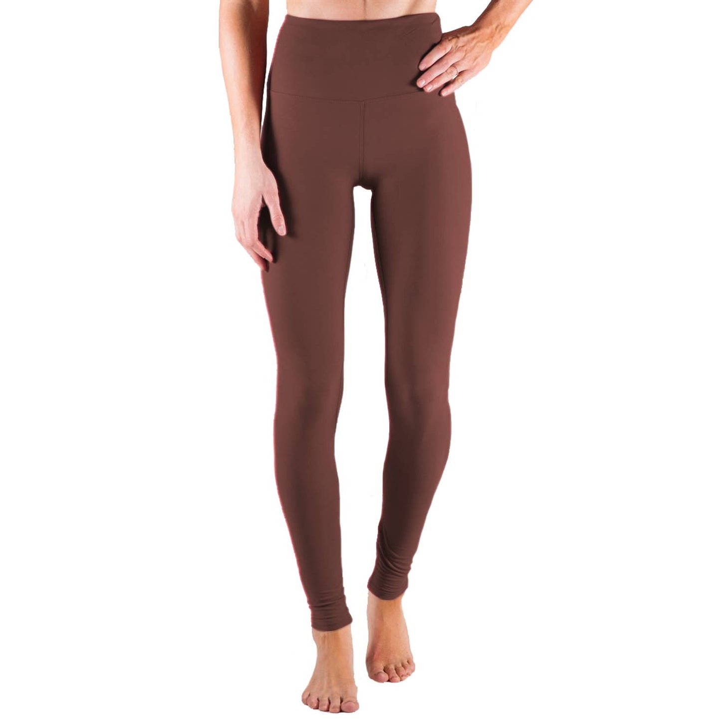 Brown leggings worn by a person on a white background