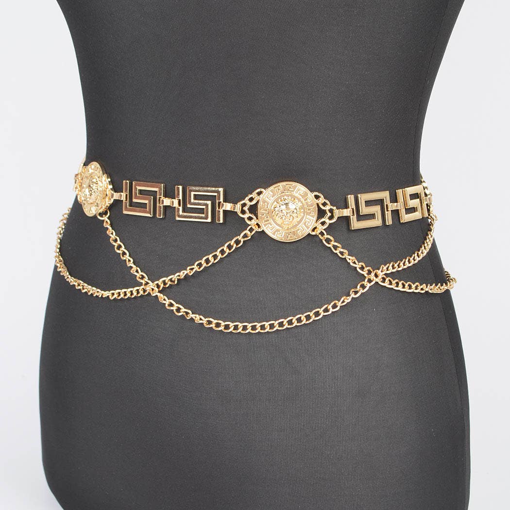 Gold chain belt on a black mannequin against a white background
