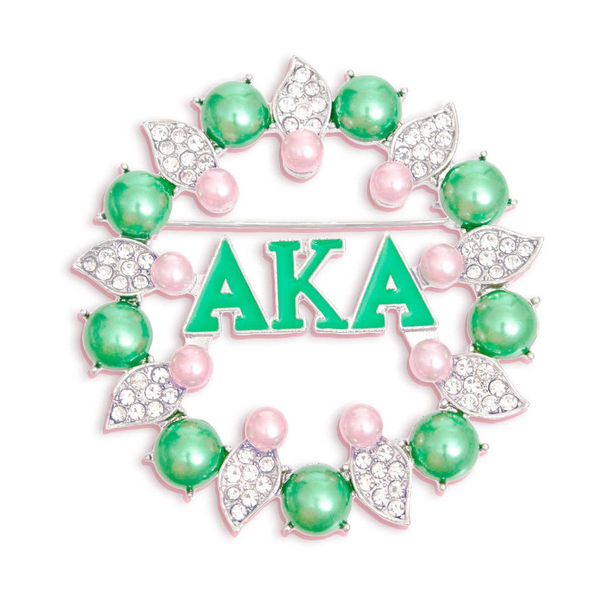 Decorative brooch with 'AKA' letters surrounded by green and pink beads on a white background