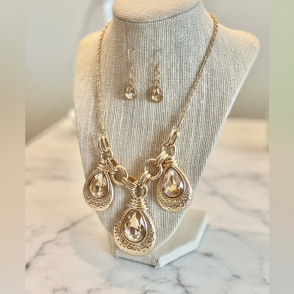 Jewelry set with necklace and earrings on a mannequin bust.