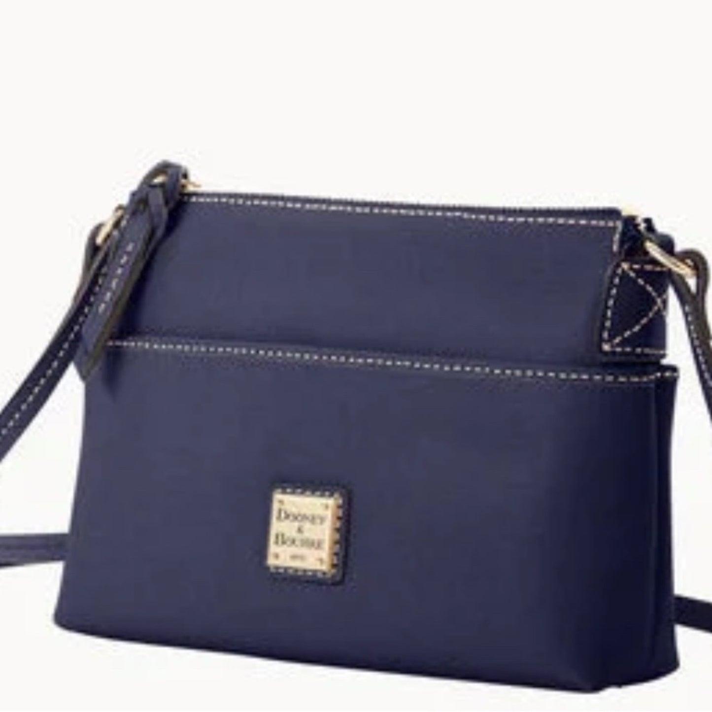Navy blue crossbody bag with visible brand logo on a white background
