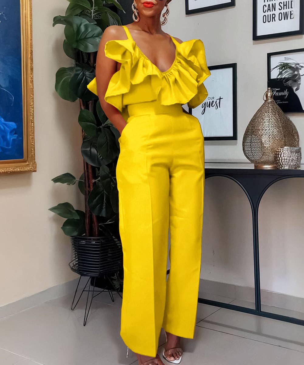 Woman wearing a bright yellow outfit in an indoor setting with decor elements.