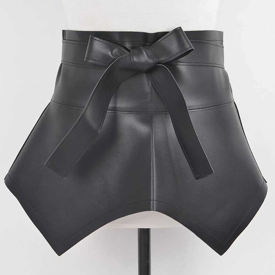 Black leather skirt with a bow on a mannequin against a white background