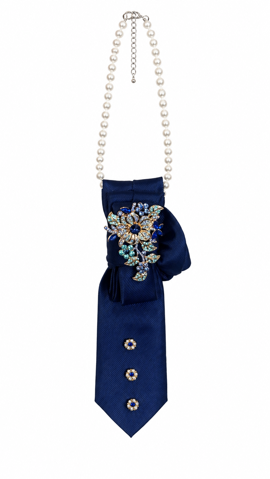 Navy blue tie with decorative elements and a pearl necklace on a white background
