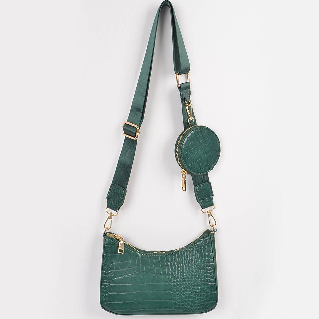 Green handbag with matching round pouch on a white background