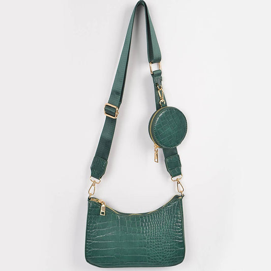 Green handbag with matching round pouch on a white background