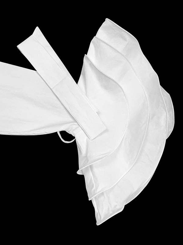 White sandal with a thick strap on a black background