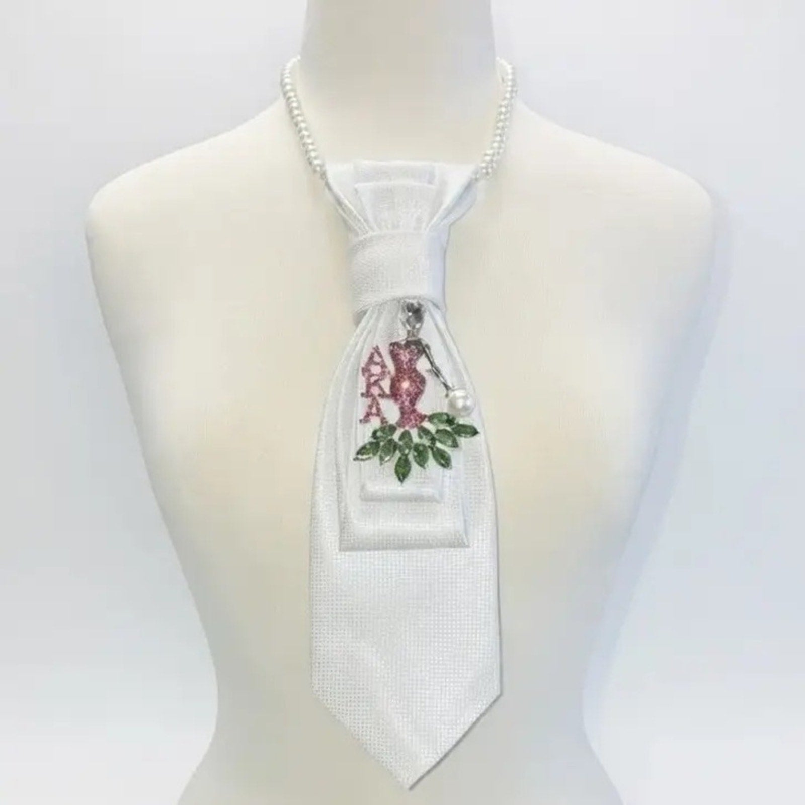 White tie with floral design on a mannequin against a white background