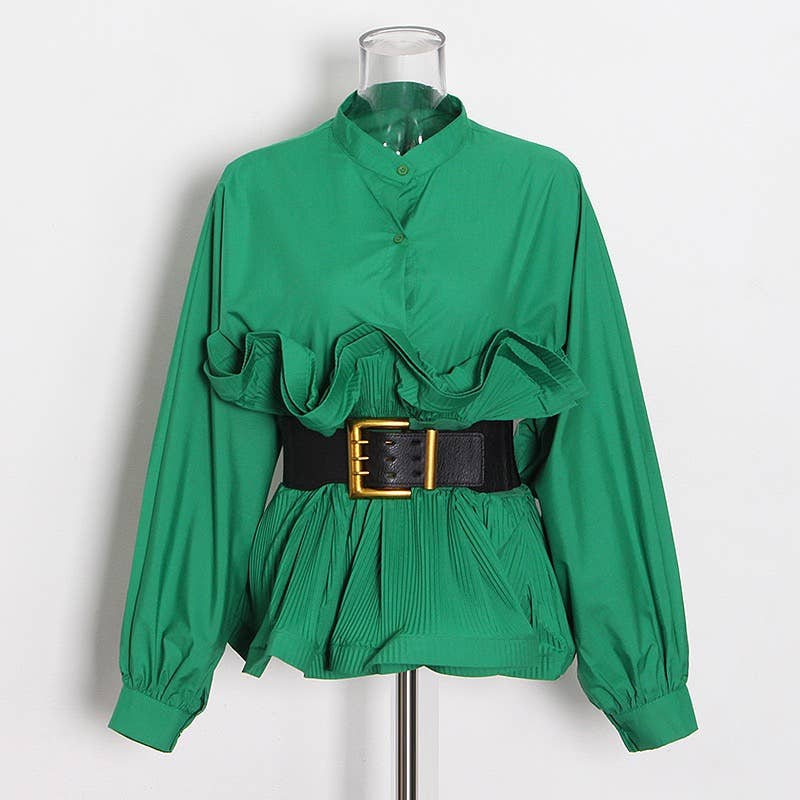 Green blouse with ruffled details and a black belt on a mannequin against a white background