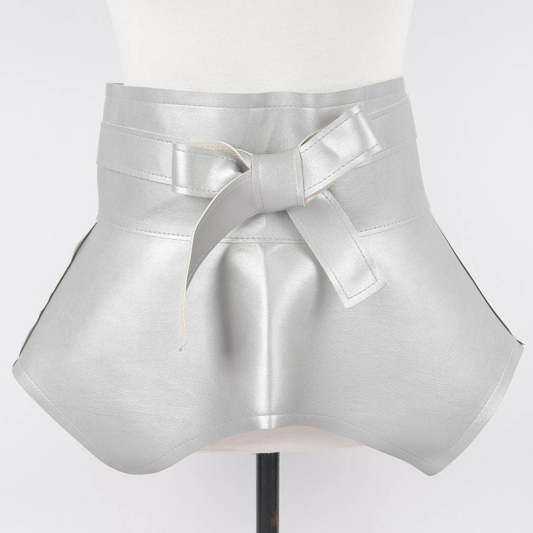 Silver metallic skirt with a bow on a mannequin against a white background