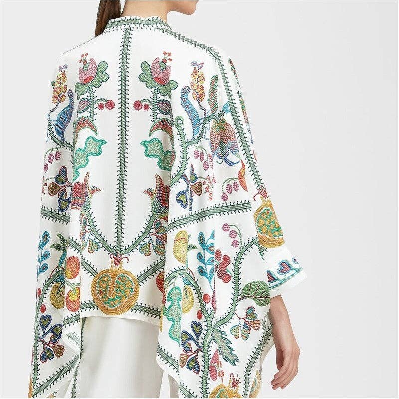 Colorful embroidered garment on a white background