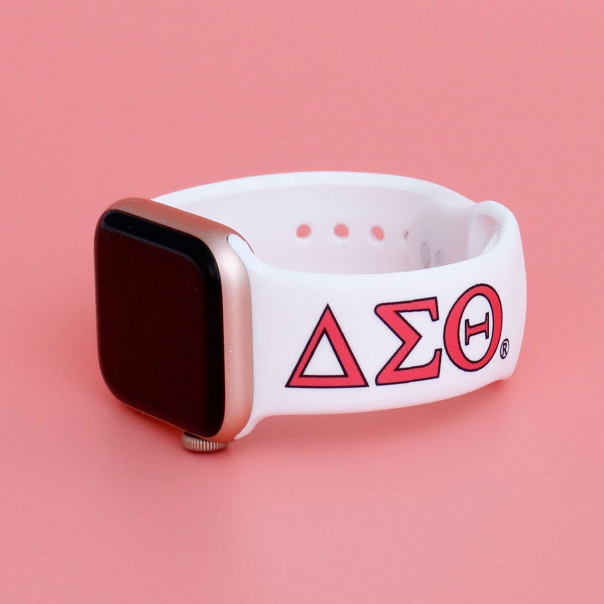 Smartwatch with a white band featuring a red logo on a pink background