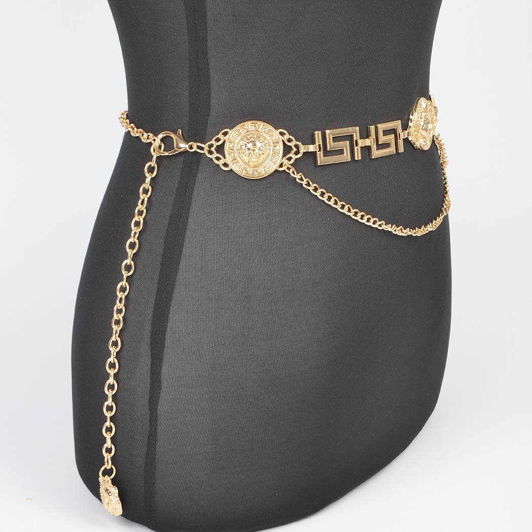 Gold chain belt with decorative elements on a mannequin bust.