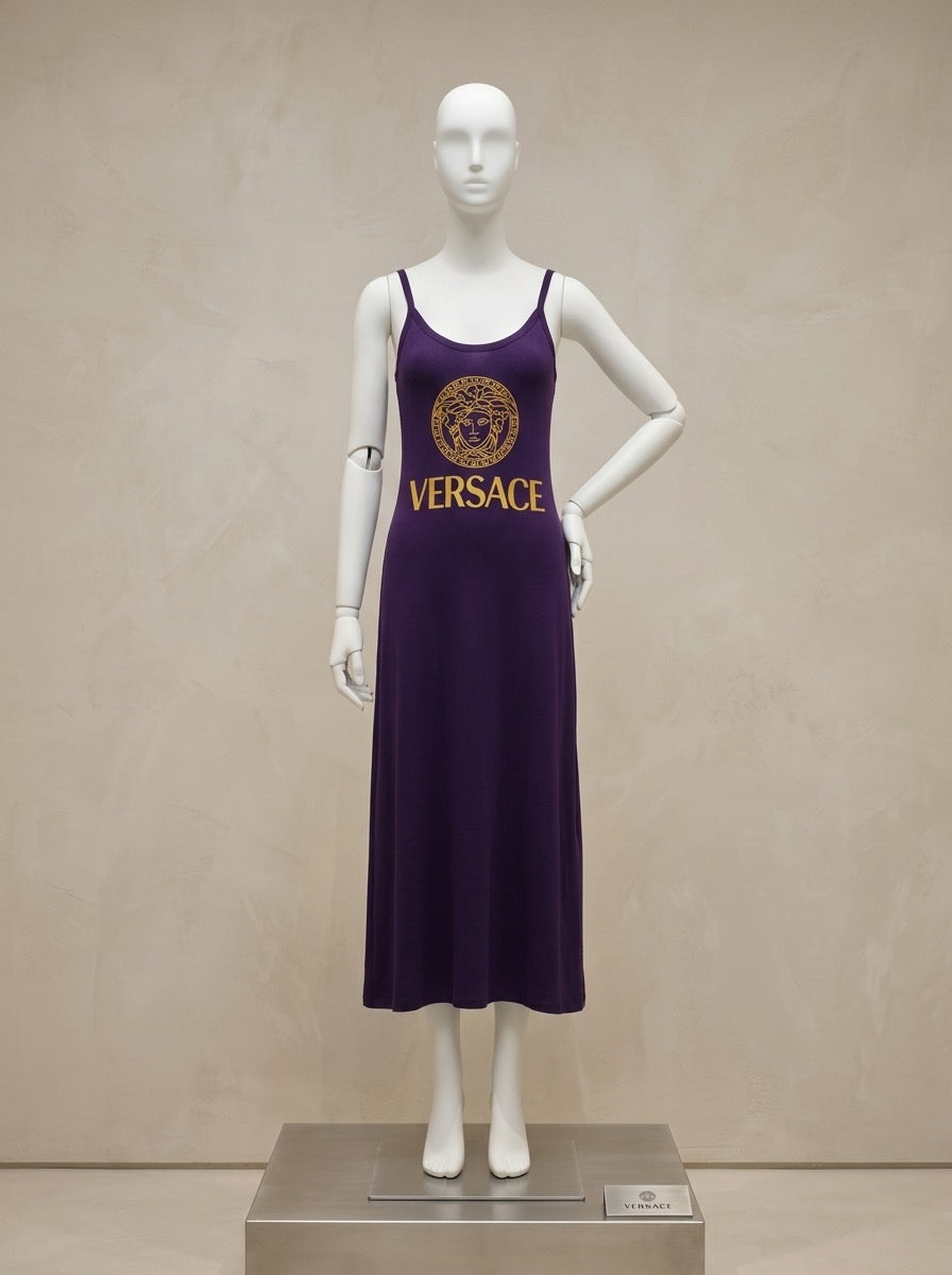 Mannequin wearing a purple Versace dress against a beige background