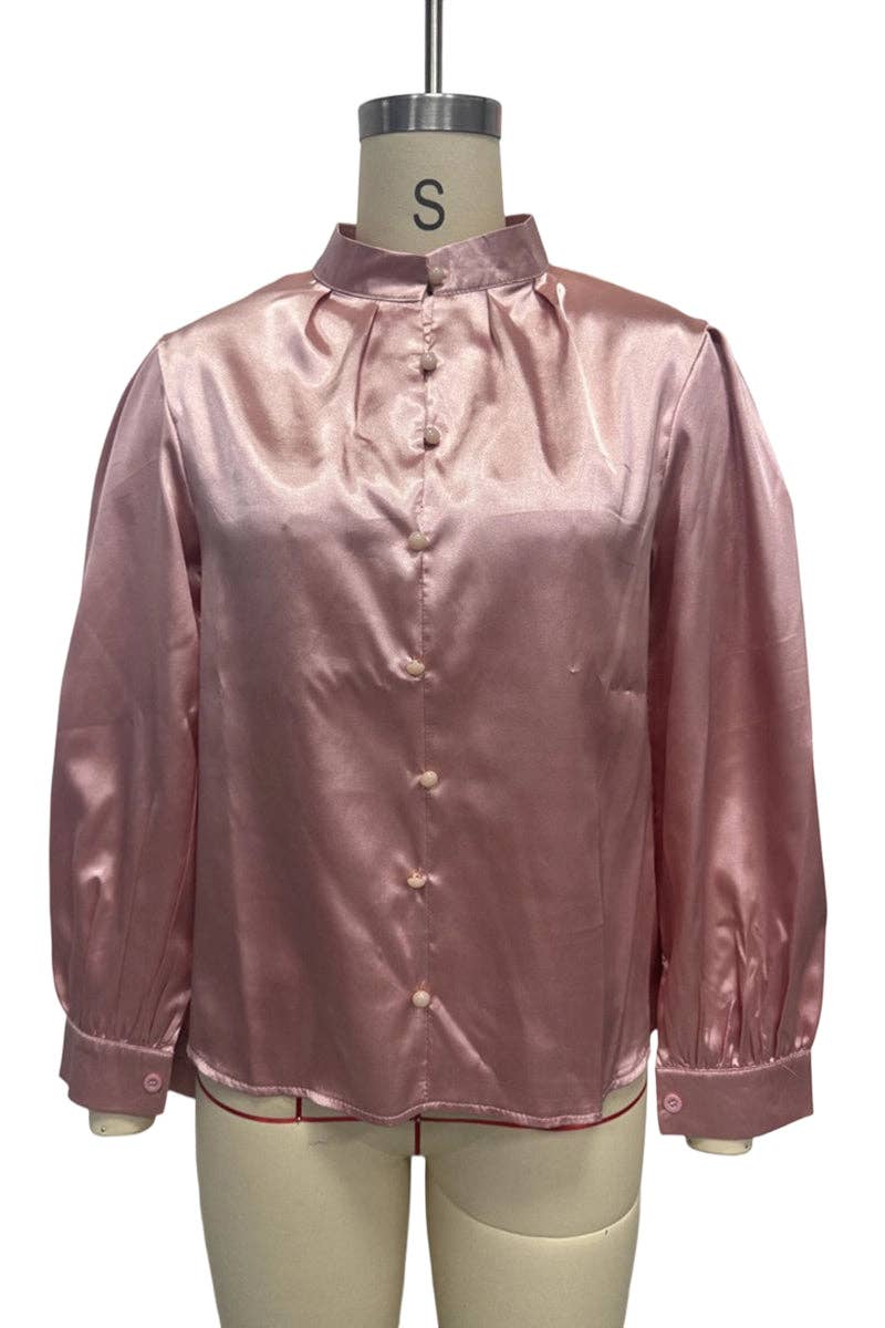 Pink satin blouse on a mannequin with a white background