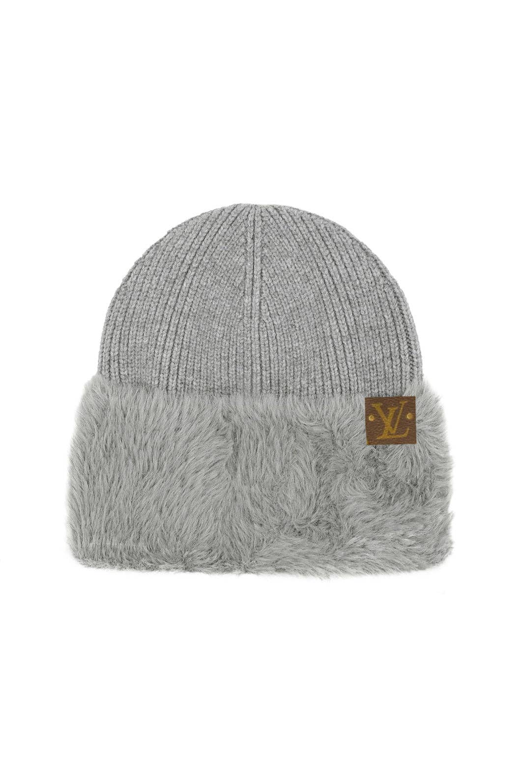 Gray knit beanie with fuzzy edge and brand logo on a white background