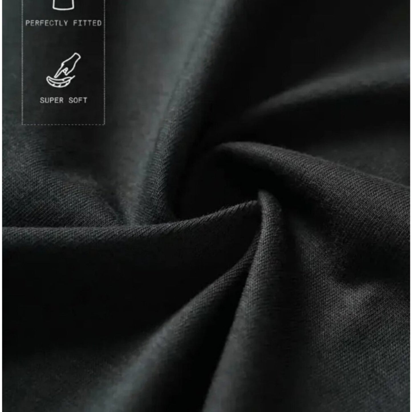 Close-up of dark fabric with 'Perfectly Fitted' and 'Super Soft' text on a dark background