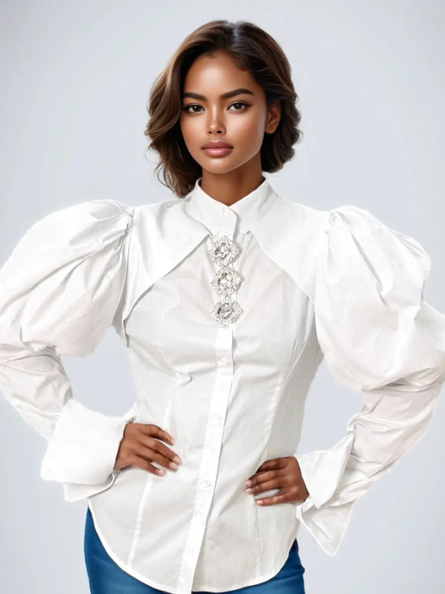 Woman wearing a white blouse with puffed sleeves on a light gray background