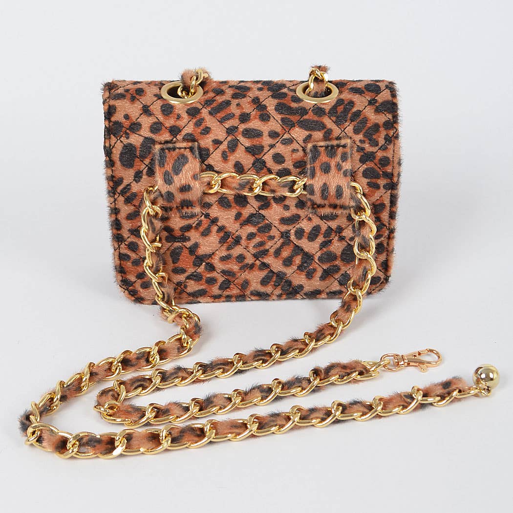 Leopard print handbag with gold chain strap on a white background