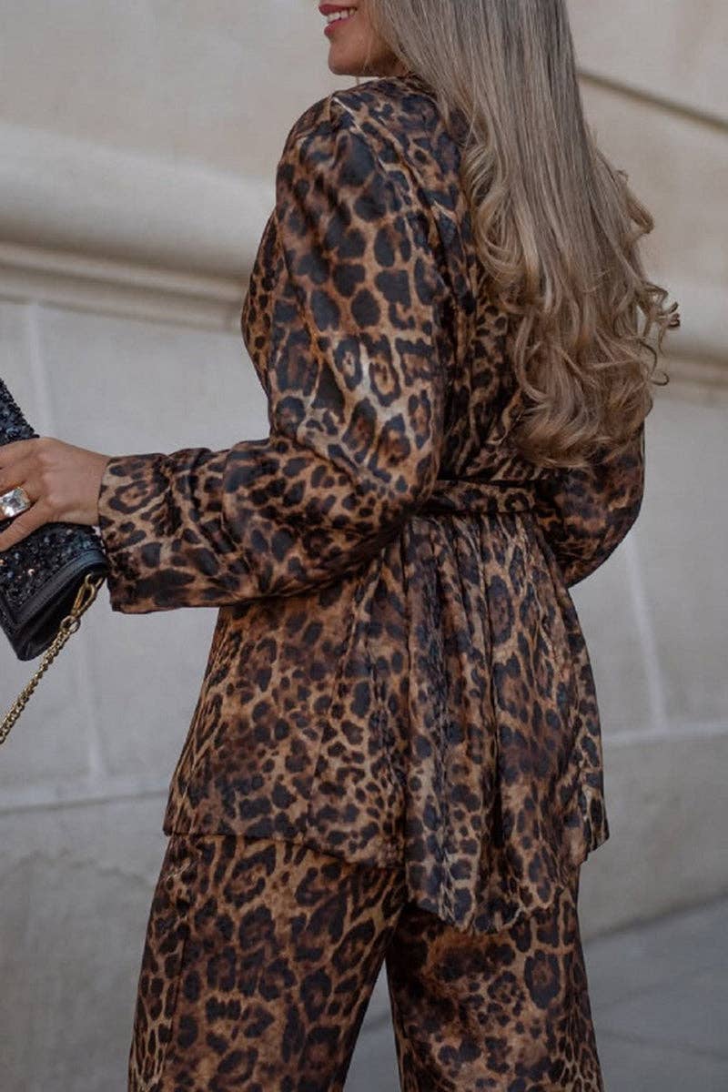 Person wearing a leopard print outfit with a blurred background