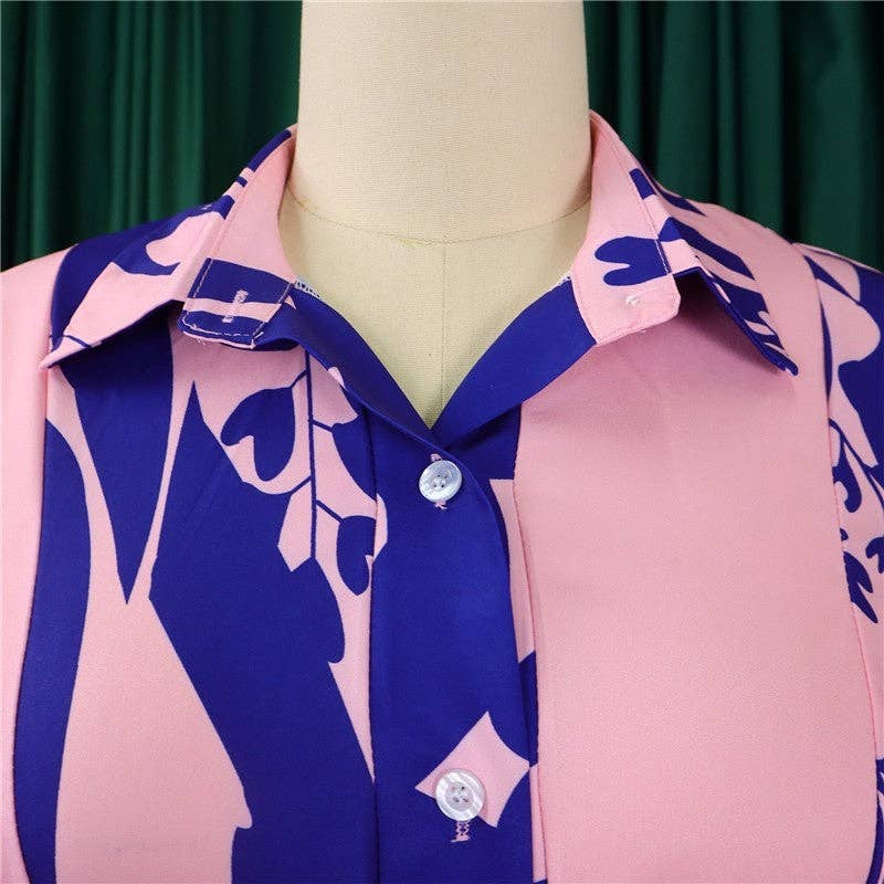 Pink and blue patterned shirt on a mannequin with a green curtain background