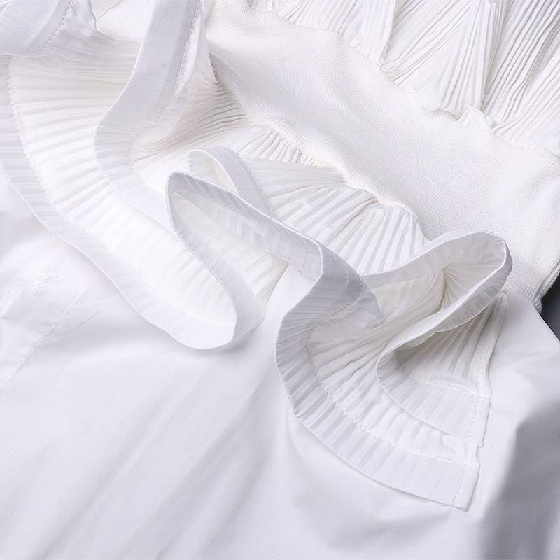 Close-up of white fabric with ruffled details