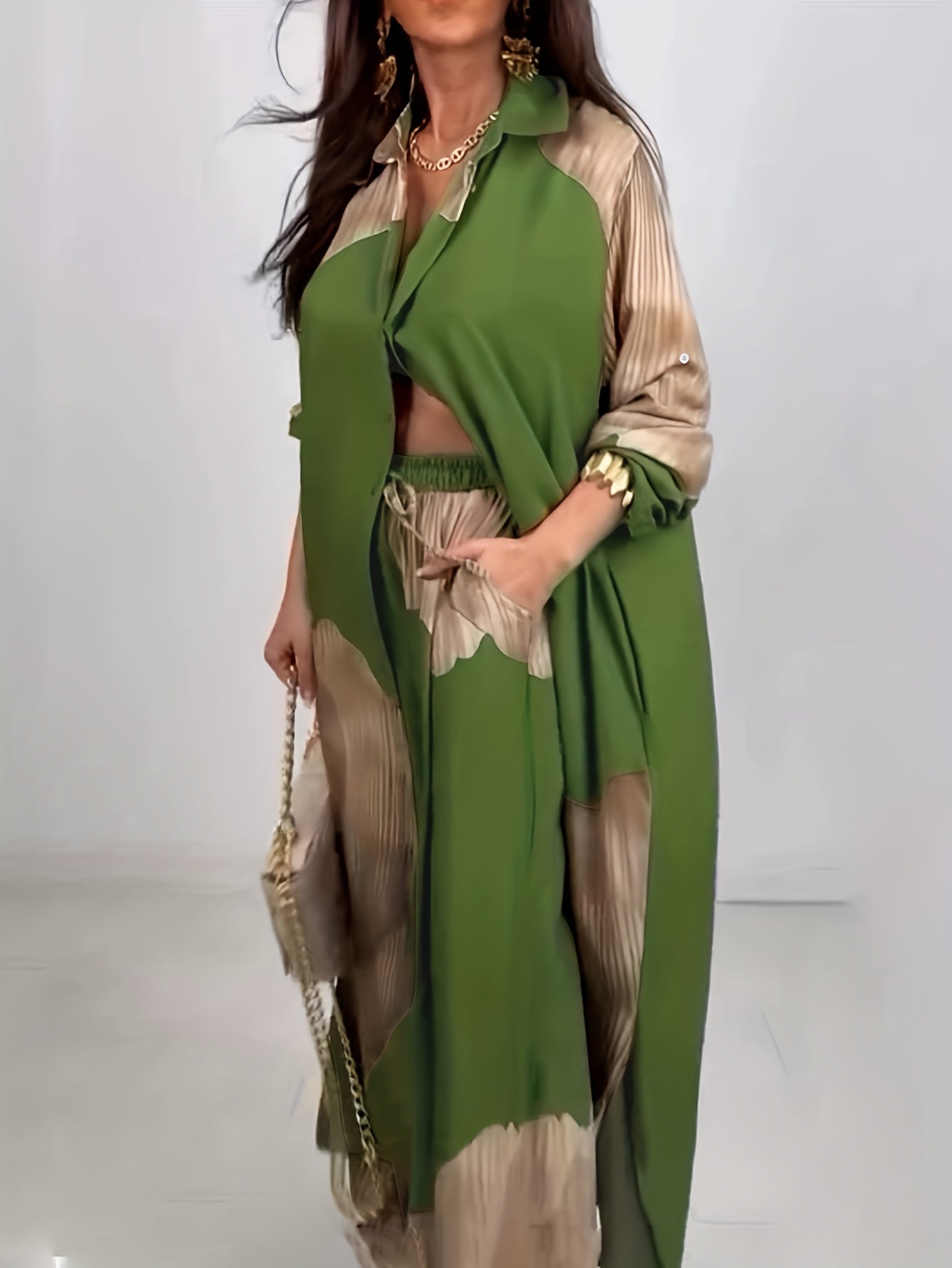 Woman wearing a green and beige outfit with a white background