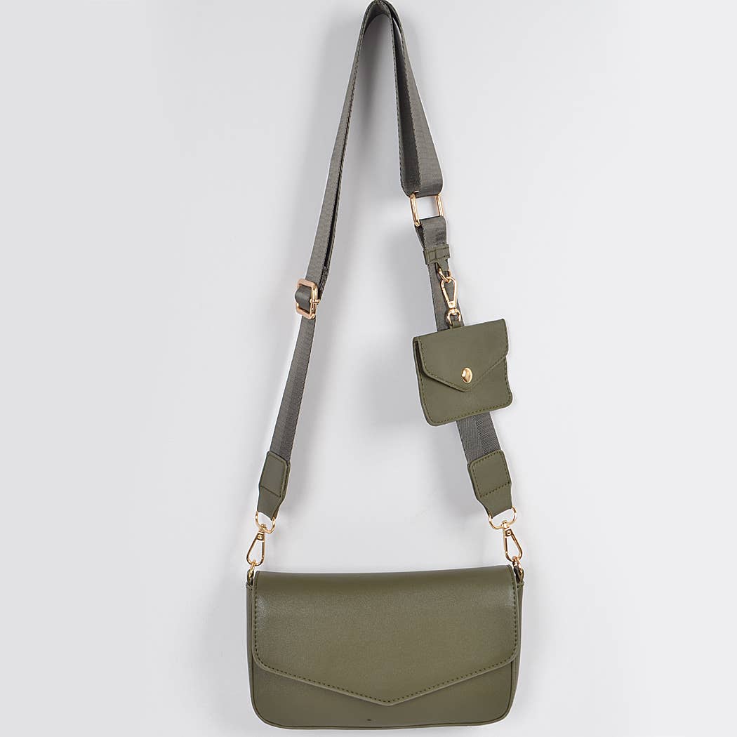 Green crossbody bag with a strap on a light gray background