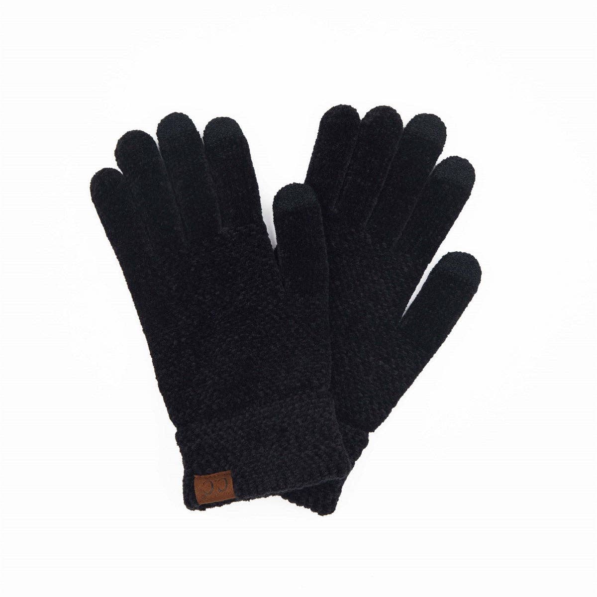 Pair of black gloves with a brown label on a white background