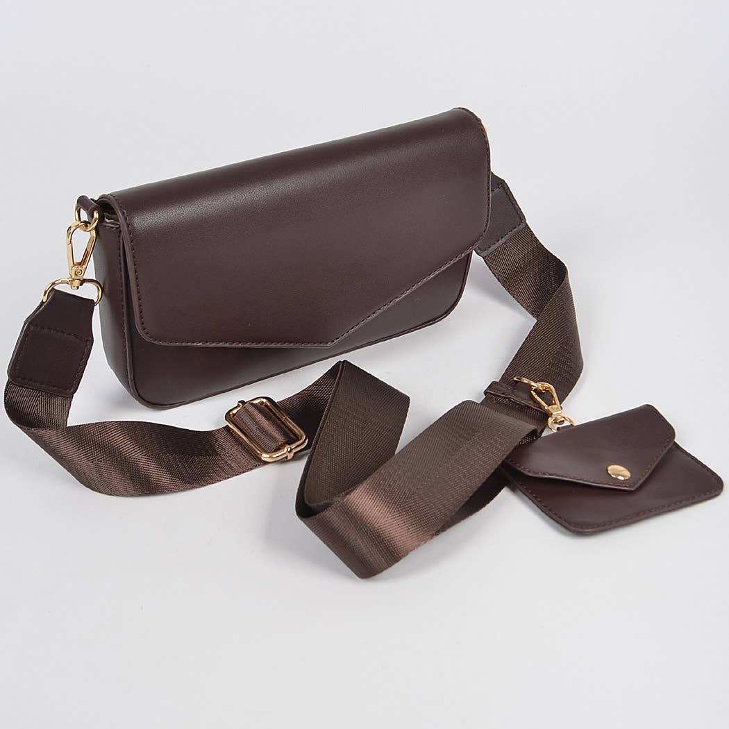 Brown leather bag with matching pouch on a light gray background