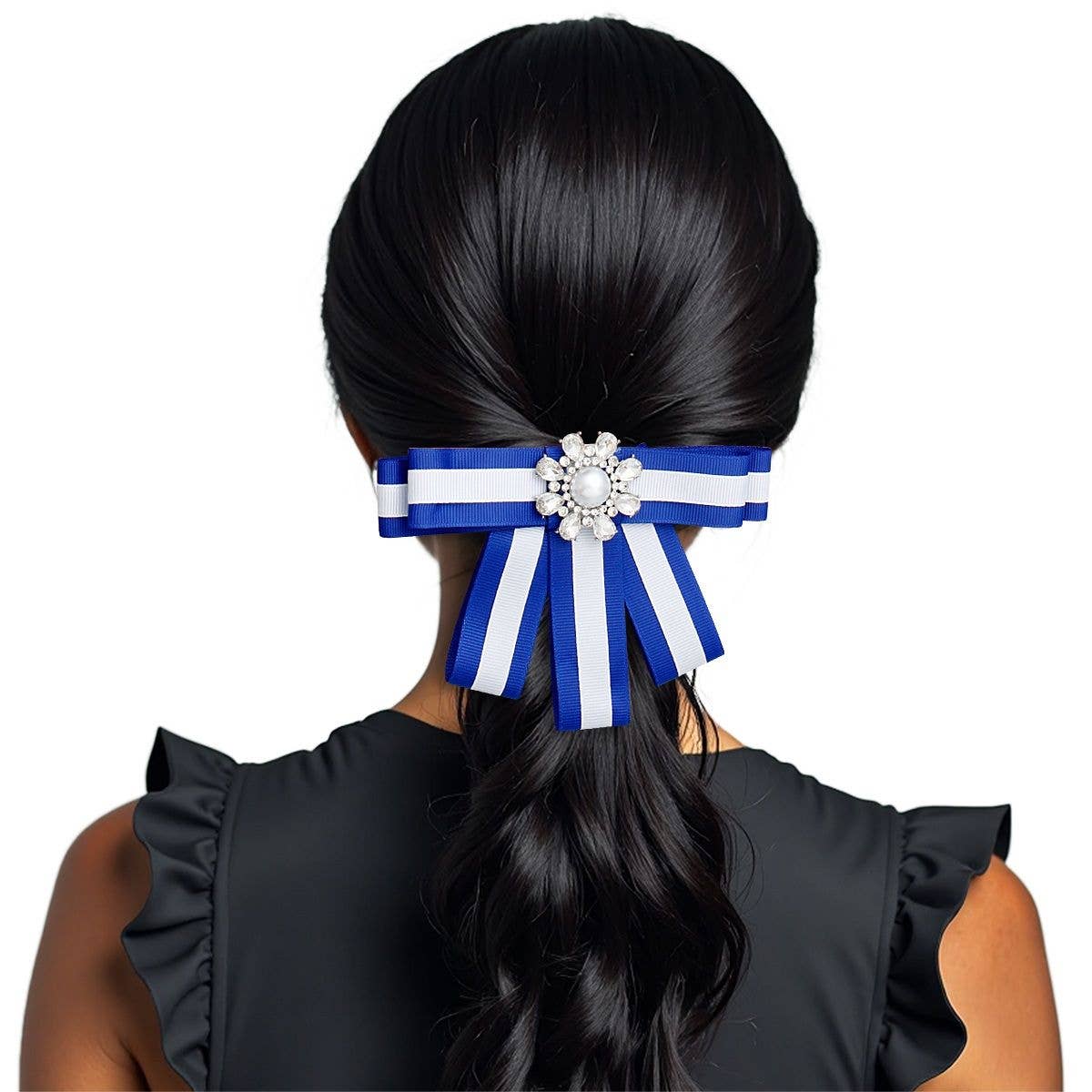 Hair accessory with blue and white ribbons and a decorative element on a person's hair against a white background.