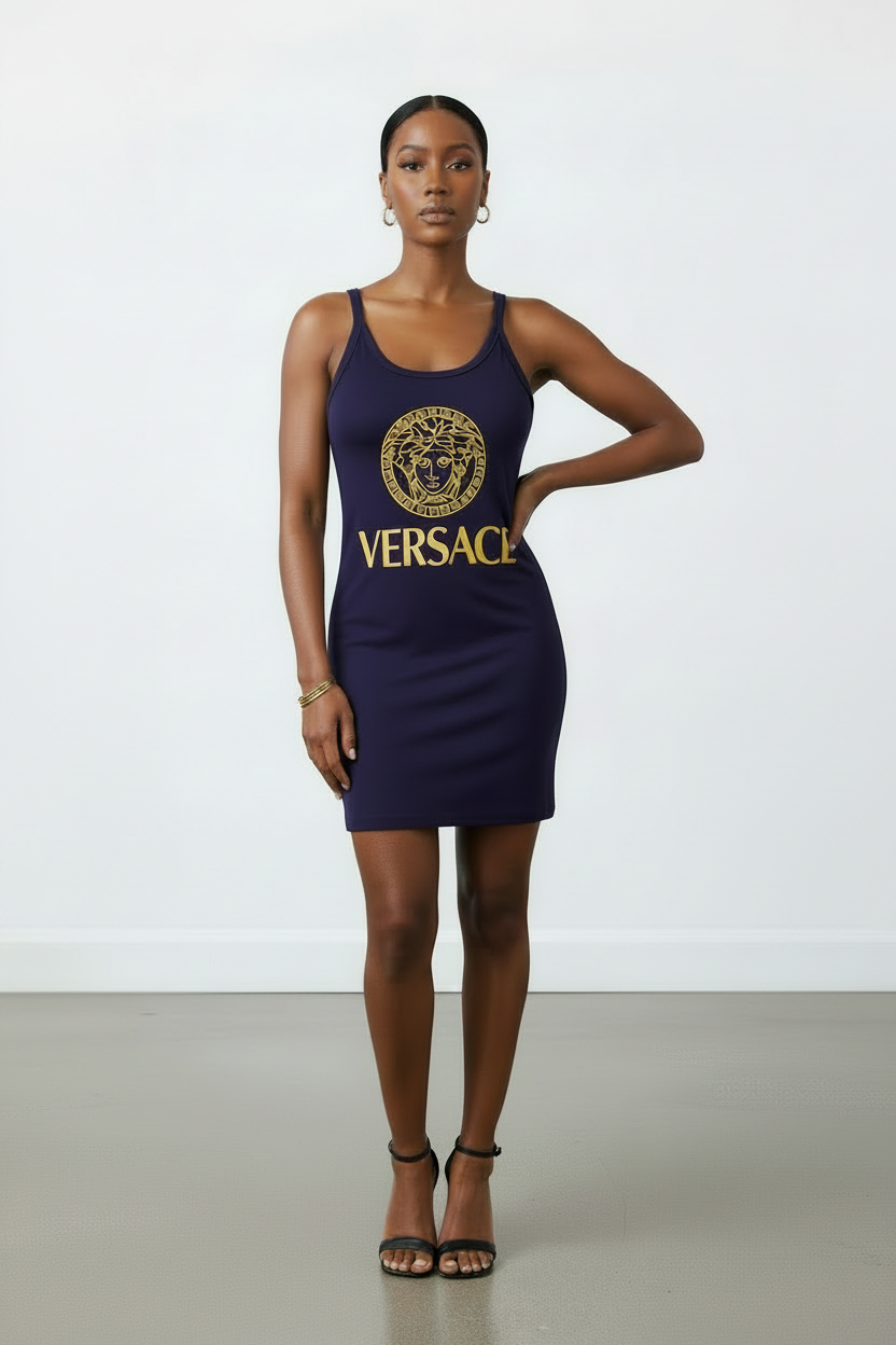 Woman wearing a navy Versace dress against a white background