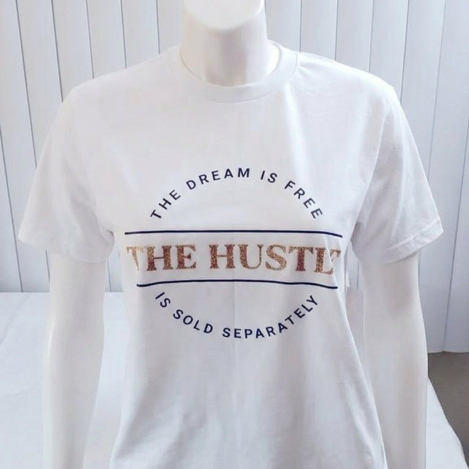 White t-shirt with text on a mannequin against a white background