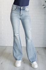 Load image into Gallery viewer, Caroline Mid Rise Control Top Distressed Flare Jeans
