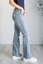 Load image into Gallery viewer, Caroline Mid Rise Control Top Distressed Flare Jeans
