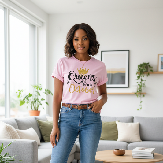 Pink t-shirt with 'Queens are born in October' text on a mannequin with jeans.