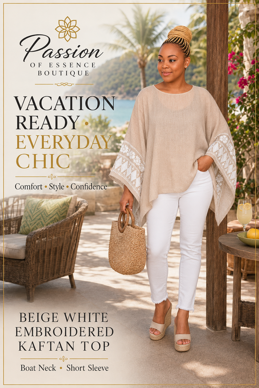 A woman models a beige and white embroidered kaftan top in an outdoor resort setting. The top features a boat neck and short sleeves with white lace embroidery on the cuffs.