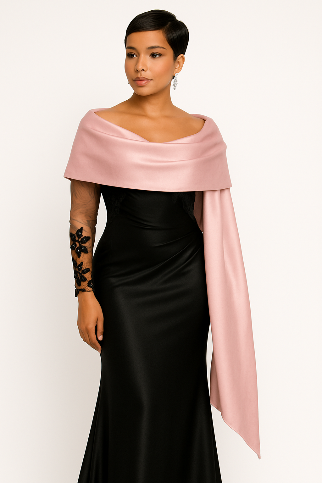 Woman wearing a black dress with a pink shawl on a white background
