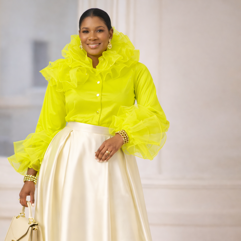 Woman wearing a bright yellow outfit with a white background